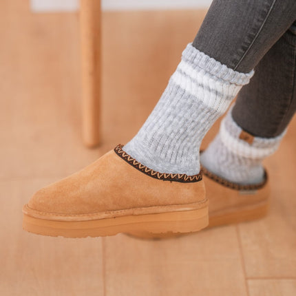 Close-up of BEARPAW Women's Martis Clog in Iced Coffee worn on foot, highlighting relaxed everyday styling.