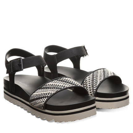 BEARPAW Women's Orion Sandal in Black and White worn on foot with casual warm-weather styling for everyday summer wear.