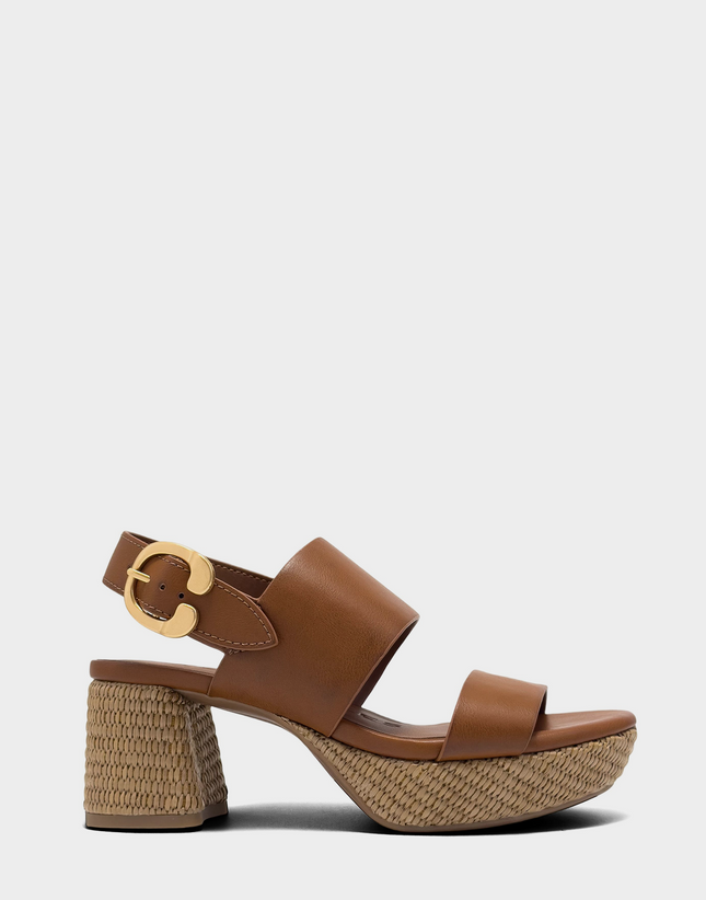 Brown sandal with woven block heel on a light gray background