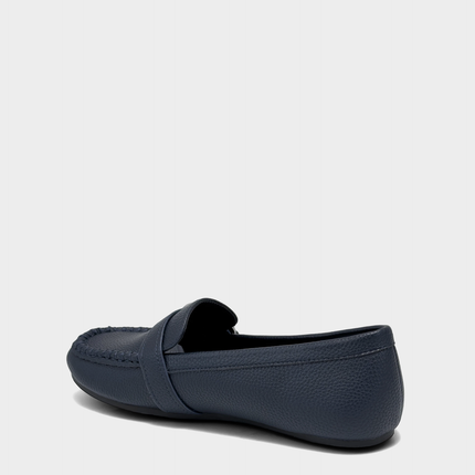 Lateral view of the Dinetta navy slip-on loafer highlighting the Stitch 'N Turn construction for out-of-the-box flexibility.
