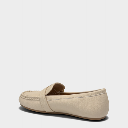 Lateral view of the Dinetta slip-on loafer in Stone highlighting the Stitch 'N Turn construction for superior flexibility.