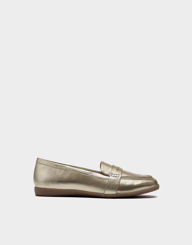 Side profile of the Aerosoles Kody loafer in Gold Metallic Faux Grain featuring a flexible step-in silhouette and a low, walkable heel.