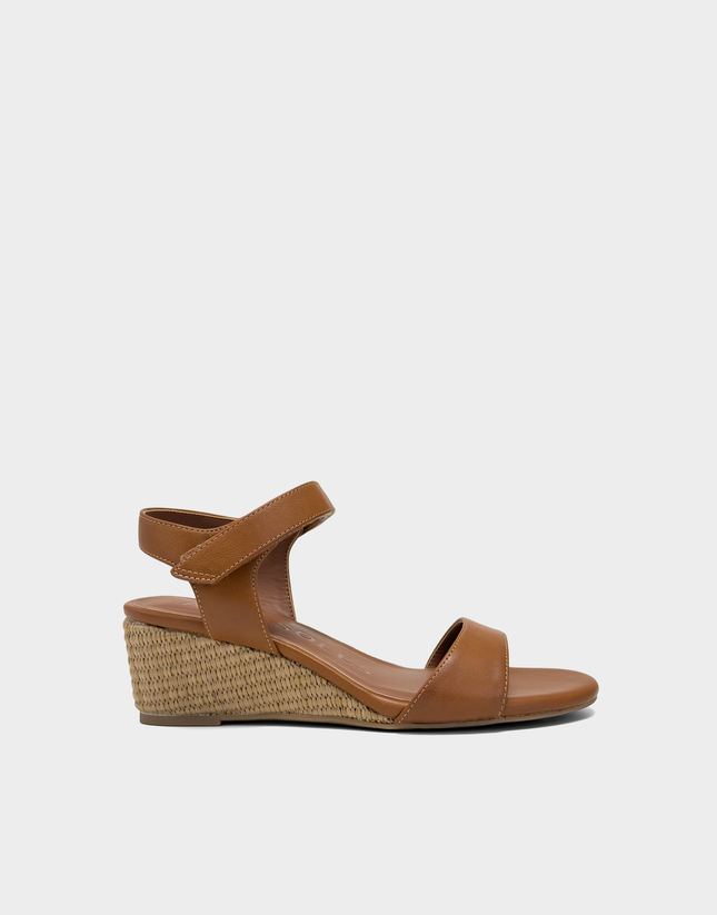Side profile of the Aerosoles Wel wedge sandal in Tan Faux Leather featuring a smooth matte finish and a stable mini wedge heel.