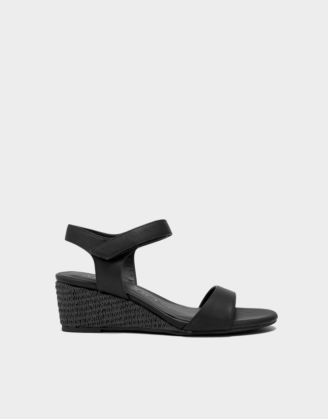 Side profile of the Aerosoles Wel wedge sandal in Black Patent featuring a glossy finish and a stable, walkable mini wedge heel.
