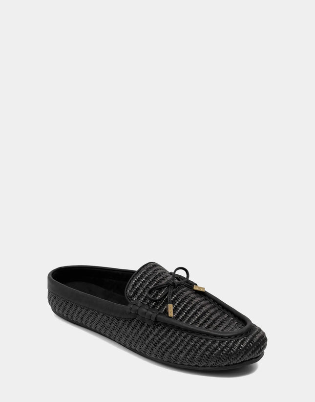 Angled view of the Aerosoles Daffodil black mule showcasing the polished loafer-style upper and intricate woven raffia texture.